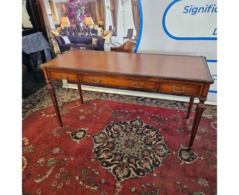 Regency Style Mahogany Writing Table The beaded rectangular top with eared corners and inset with tooled tobacco coloured lea