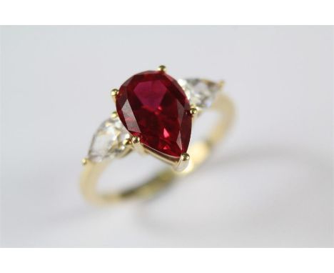 A 14ct Yellow Gold Ruby Ring. The tear-cut center stone approx 10 x 7mm, size L, approx 3 gms. (*synthetic ruby)