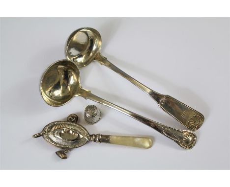 A Pair of Scottish Silver Sauce Ladles. The first ladle Edinburgh hallmark dated 1844 the other Edinburgh hallmark dated 1832
