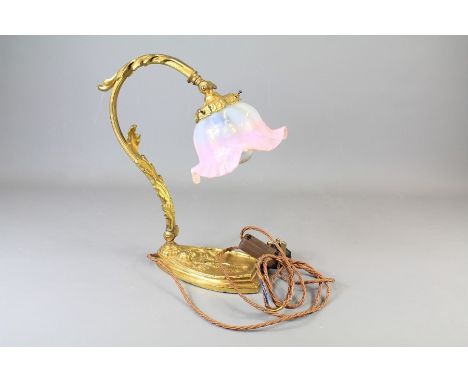 A French Gilt Brass Table Lamp. The table lamp with foliate Vaseline glass shade and decorative base.
