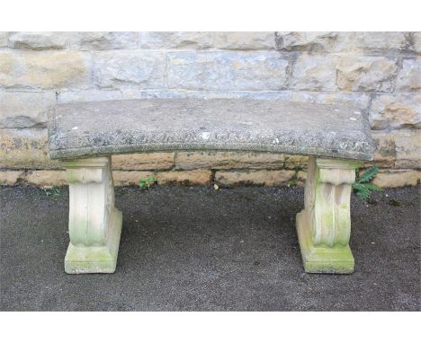 A Stone Garden Bench. The bench on scroll supports, approx 105 cms x 54 cms h
