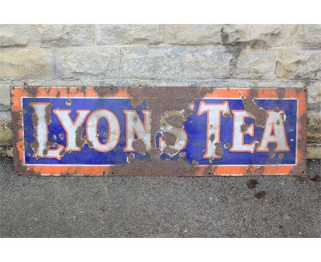A Large 1930s 'Lyons' Tea' Enamel Advertising Sign. The navy blue and orange sign approx 150 x 46 h cms (some corrosion and l
