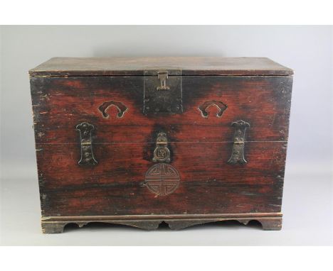 A Wooden Chinese Chest. The chest having handles to the sides, front opening, on bracket feet, approx 87 x 39 x 59 cms.&nbsp;
