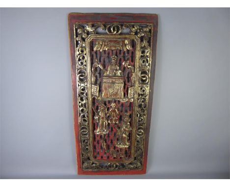 A Chinese Wooden Panel, the panel carved in relief depicting judgement, a seated figure with a prostrate figure before him, a