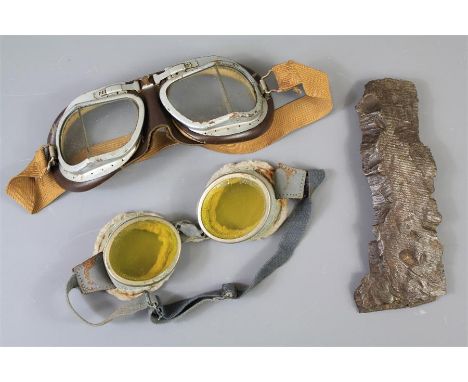 Two pairs of WWI/WWII Aviator Flying Goggles. The first being a&nbsp;pair of WWI goggles (possibly German), with yellow-tinte