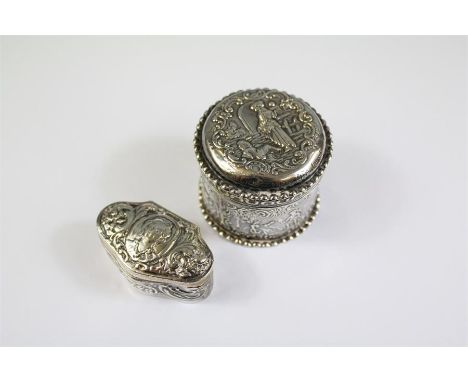 A Circular French Silver Trinket Box. The box embossed with figures, import marks to the base, approx 67 gms, together with a