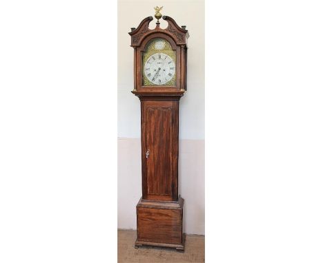 A Long-Cased Grandfather Clock. The 8 day mahogany cased clock with broken pediment and brass eagle and ball finial with blin