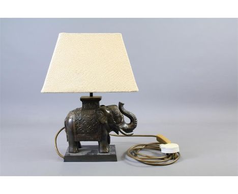 A Table Lamp. The lamp in the form of a elephant and supported on a square plinth, cream shade, approx 37 x&nbsp; 10 x 22 cms