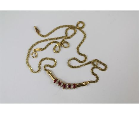 A 9ct Yellow Gold and Ruby Pendant Necklace. The necklace approx 43 cms, the pendent set with an oval ruby approx 3.5 x 2mm, 