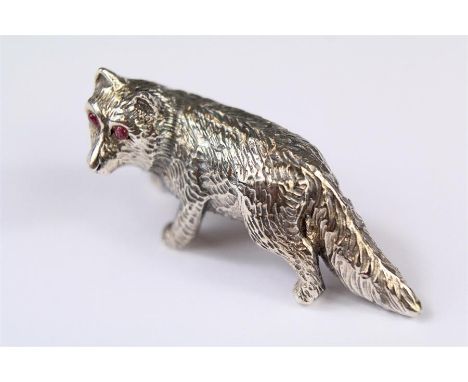 A Sterling Silver Fox. The fox set with ruby eyes, approx 40 mm, approx 14.8 gms.