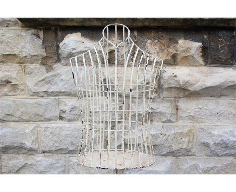 A Vintage-Style Wrought Iron Mannequin. The mannequin painted cream.