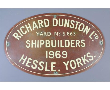 An Original Shipbuilders Brass Plaque. The oval plaque with cream enamel lettering, 'Richard Dunston Ltd, Yard No. S.863, Shi