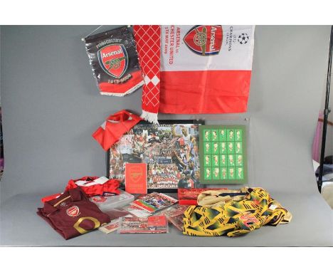 A Comprehensive Collection of Arsenal Football Memorabilia. This lot includes DVD's, Books, Playing Cards, Posters, Shirts, B