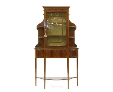 An Edwardian mahogany and inlaid display cabinet, the upper section with central glazed cabinet flanked by open shelves, the 