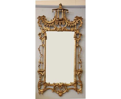 A Chippendale style gilt pier mirror, the shaped plate within a 'C' scroll decorated frame, 81cm x 160cm