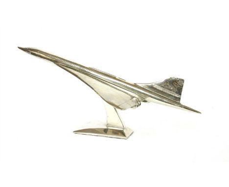 An aluminium model of Concorde on stand, 60cm long, and a metal advertisement