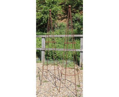 A pair of hand forged wrought iron garden obelisks of pyramidal form, each with a ball finial, 208 cm high x 60 cm wide