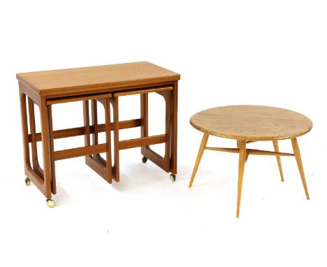 An Ercol elm table and beechwood folding coffee table, the circular top on tapering supports, 81cm diameter, 40cm high, toget