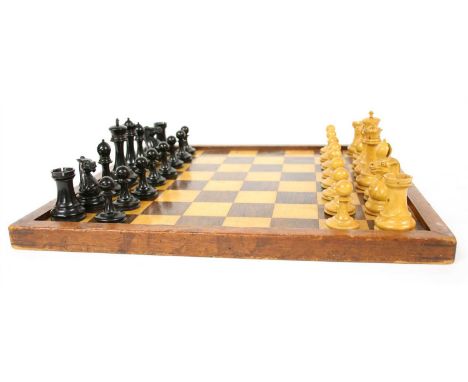 A `Tournament' size boxwood and ebonised weighted 'staunton pattern' chess set , the kings 4.25 inches high