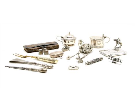 A box of silver items, to include figures, sovereign case, Georgian fork, etc.