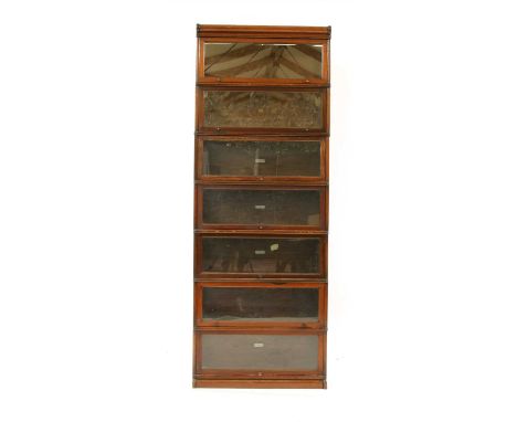 A seven section globe wernicke bookcase, with glazed front panels, 86.5cm wide, 29.5cm deep, 245cm high