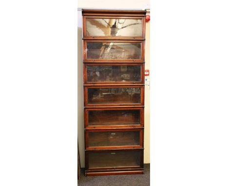 A seven section globe wernicke bookcase , with glazed front panels, 86.5cm wide, 29.5cm deep, 245cm high