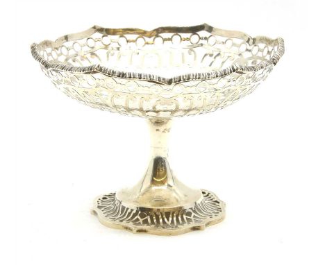 An Edwardian silver pedestal bowl, by Messrs Hutton &amp; Sons, London 1910, pierced with scrolls between pierced roundels, r