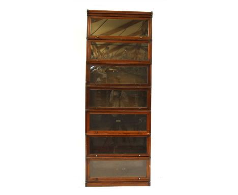 A seven section globe wernicke bookcase , with glazed front panels, 86.5cm wide, 29.5cm deep, 245cm high