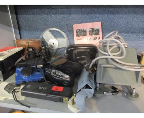 Vintage cameras and binoculars to include a Canon Sureshot AF-7, a Canon QL, a Kodak 600 and a Kodak movie camera 