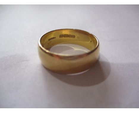 A 22ct gold wedding band, total weight 8.33g, UK ring size letter r 