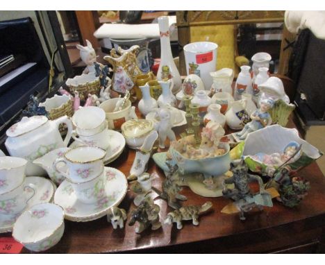 Small ceramic trinkets and ornaments to include a W.H. Goss puzzle cider cup, Swan jugs, Willow and Wade items together with 