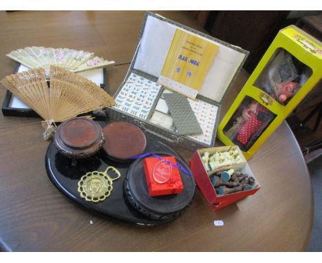 Modern Oriental stands, a mid 20th century Mahjong set, modern chess pieces, two fans, together with a Pelham Wicked Witch pu