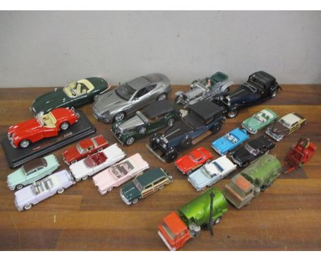 A quantity of 1980's Franklin Mint die cast collectors vehicles in the American theme together with larger collectors cars to