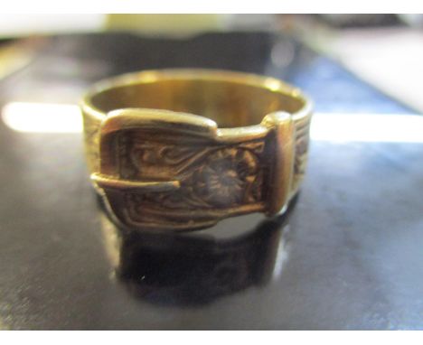 A 9ct yellow gold belt and buckle ring with engraved decoration, approximately 5.48g 