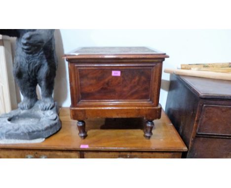 A Victorian mahogany commode with ceramic liner