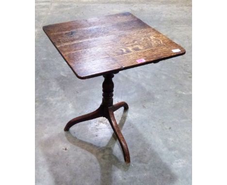 A George III oak tripod table with snap top. 22'' wide