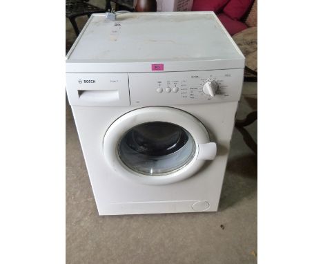 A Bosch Maxx5 washing machine finished in white enamel. Ex house clearance