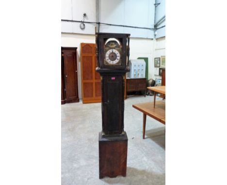 A longcase clock in very distressed condition