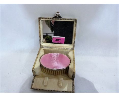 A George V silver and pink guilloche enamel hair brush. 3½'' wide. Birmingham 1927. Boxed