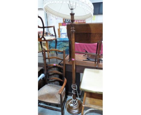 A mahogany lamp standard