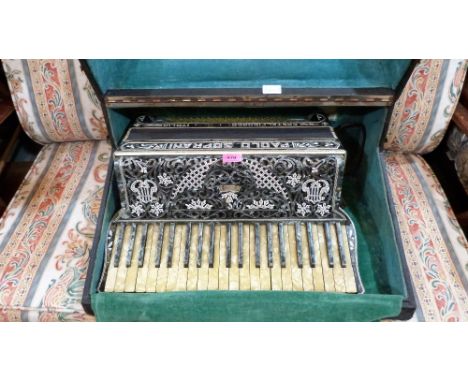 A Paulo Soprani piano accordion. Cased