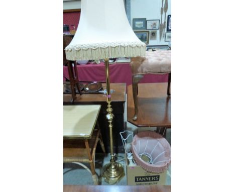 A brass lamp standard together with three table lamps