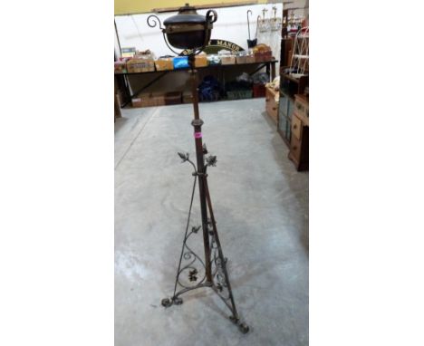 An early 20th century brass telescopic oil lamp standard
