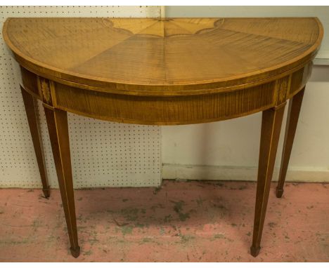 DEMI LUNE CARD TABLE, circa 1790, George III harewood, satinwood, mahogany and marquetry with fan medallion inlaid foldover a