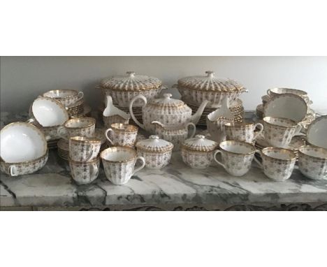 DINNER SERVICE, English fine bone china, Spode 'Fleur de Lys', gilt twelve place and five piece settings (soup coupes for ten