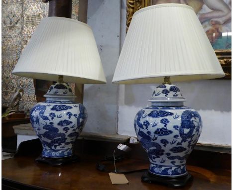 TABLE LAMPS, a pair, Chinese export style blue and white ceramic, with shades, 69cm H. (2) 