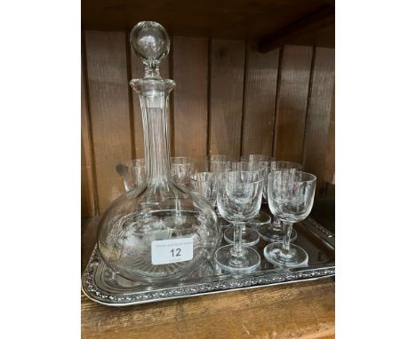 An RAF decanter with 8 associated glasses on a modern tray.