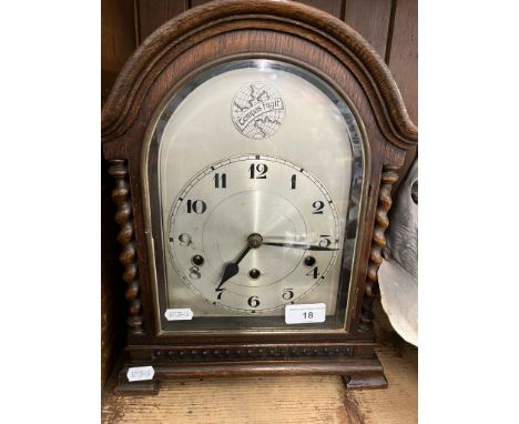 An early 20th century oak cased mantle clock.