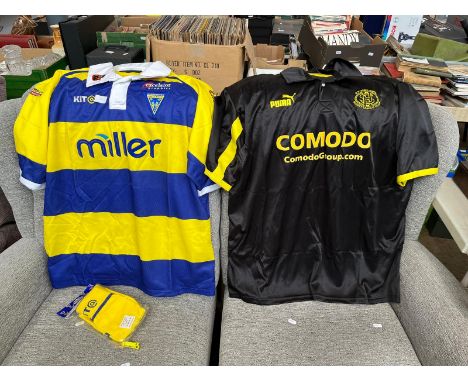 An XXL Warrington Wolves rugby shirt and socks, 2oo2 season, together with a St Helens 4XL away shirt 2003