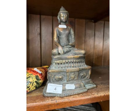 A brass Buddha statue Dimensions:- Height is approx. 27cm.